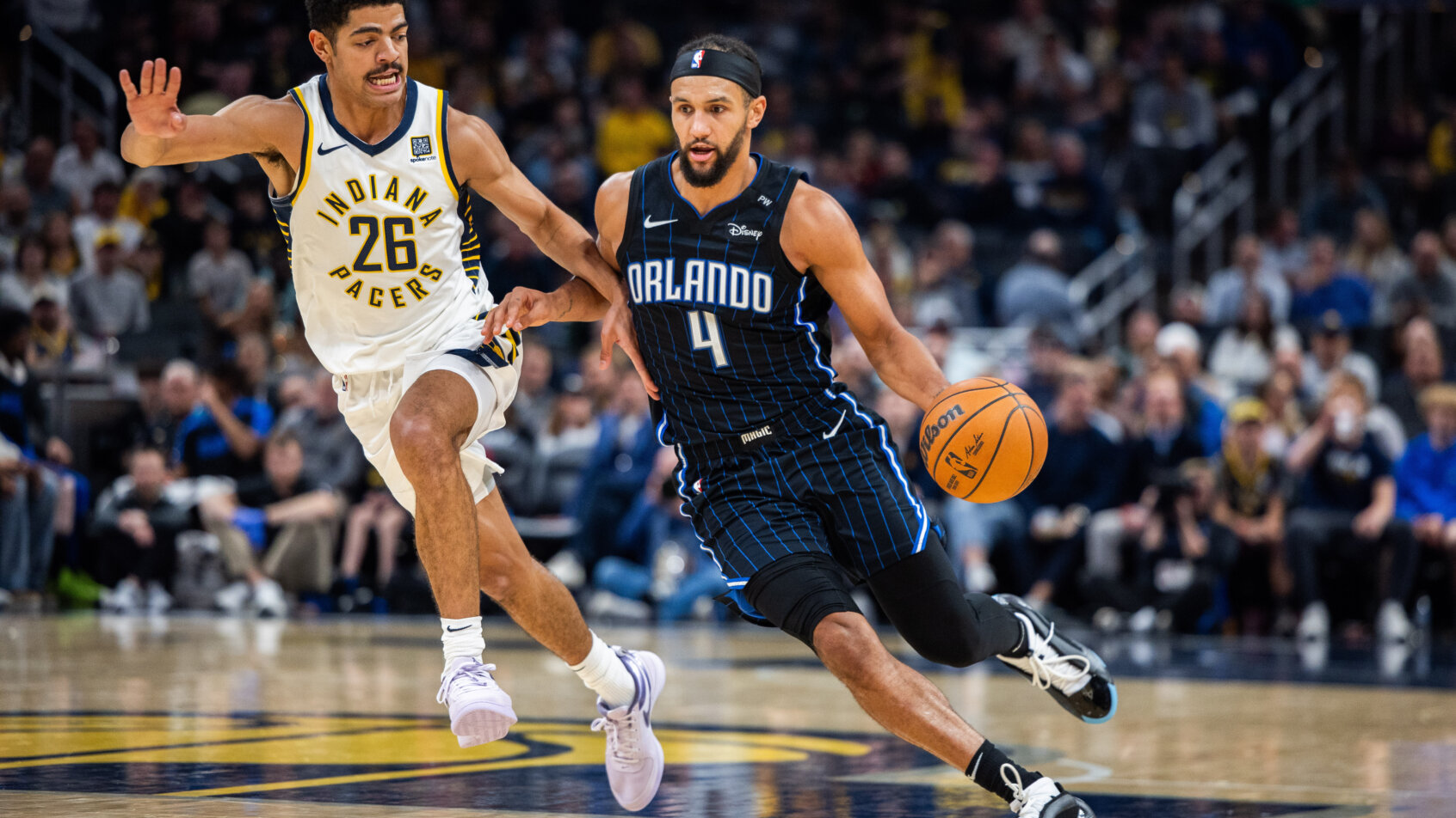 Player dribbling basketball on court