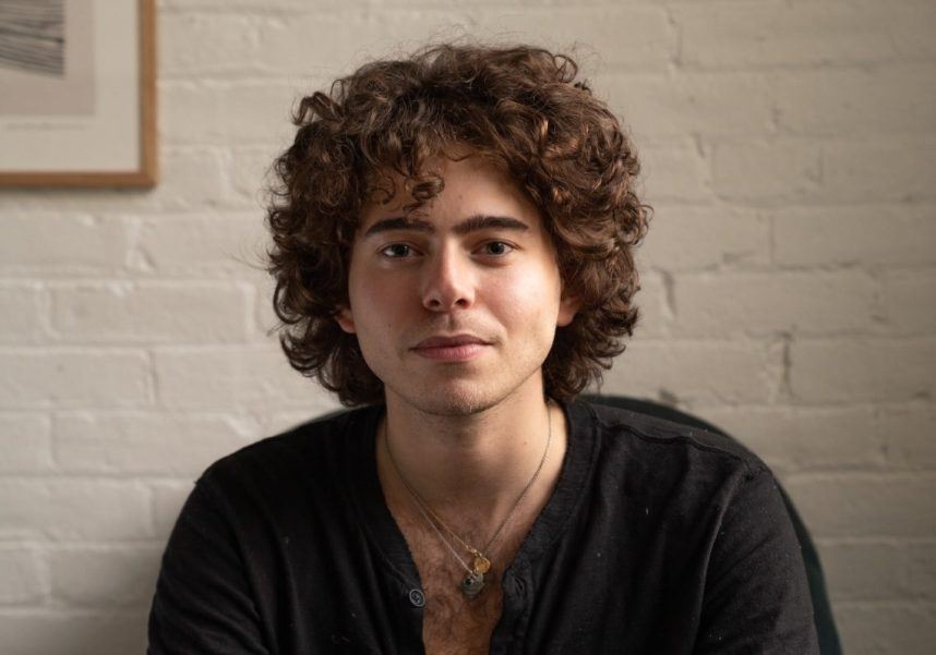 Smiling man with curly hair