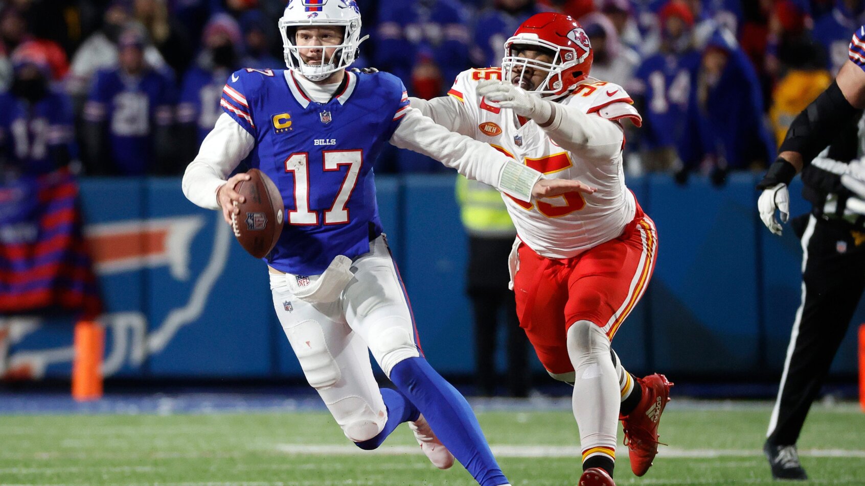 NFL player running with football