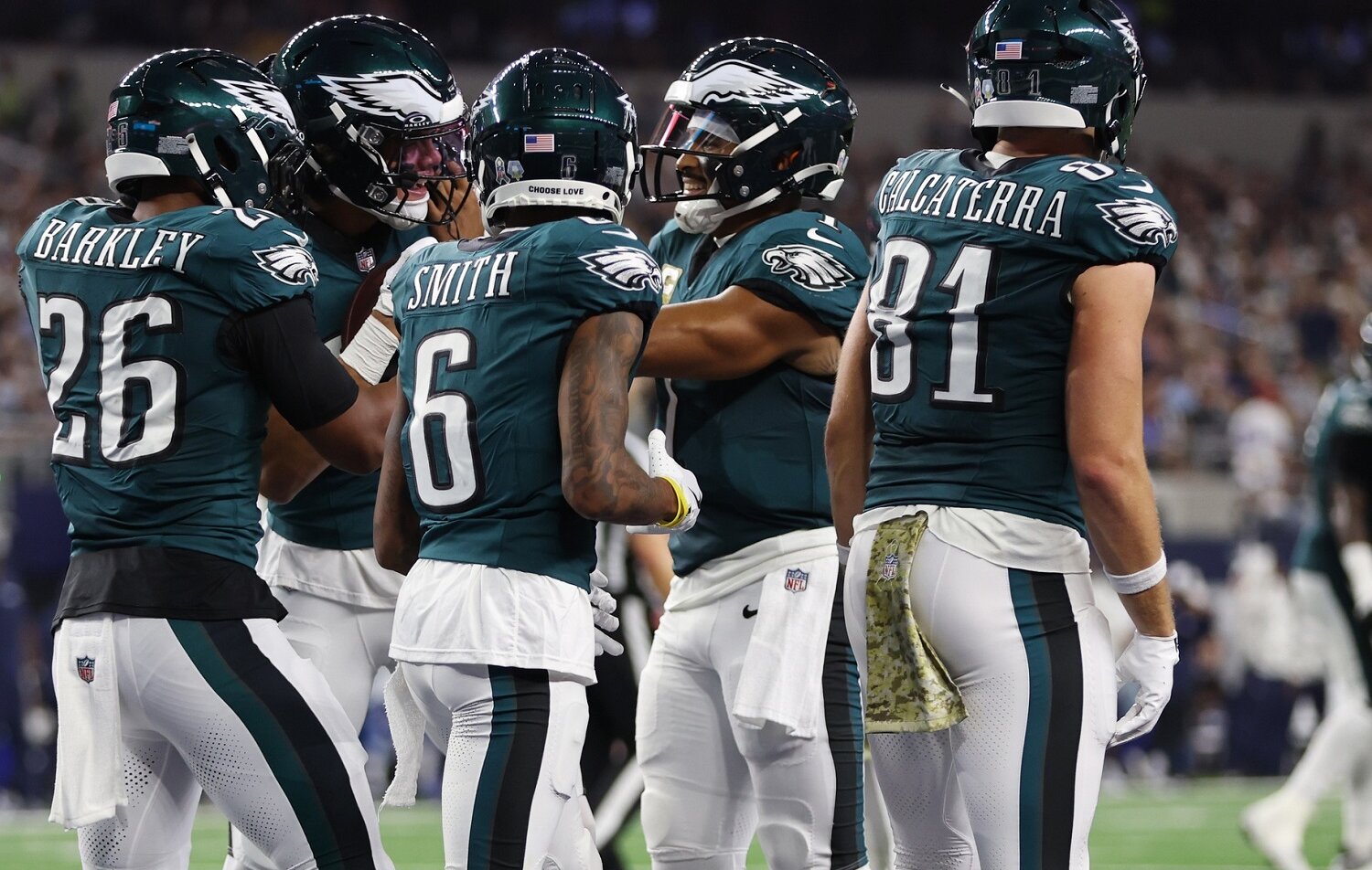 Eagles players huddle during game