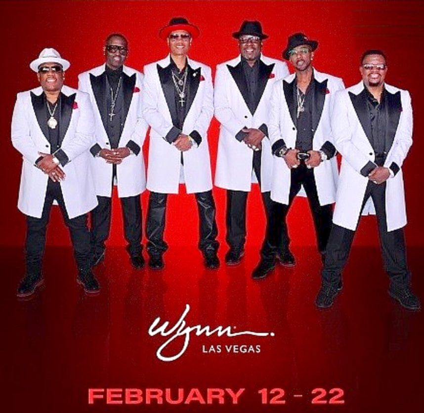 New Edition wearing matching white suits