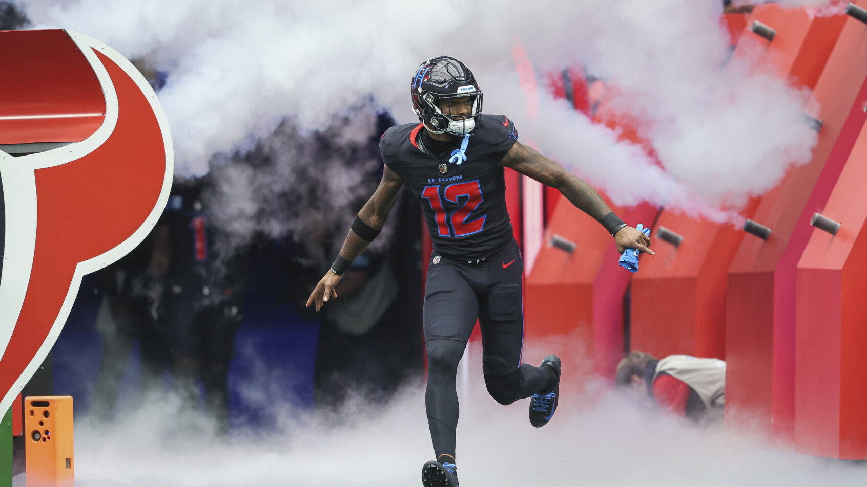 Football player sprints across field