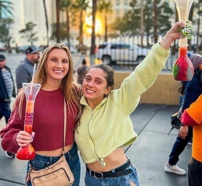 Women with drinks at Fat Tuesday