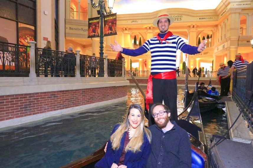 Gondola glides through Venetian canal