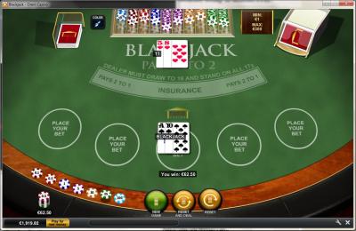 Green blackjack table with playing cards