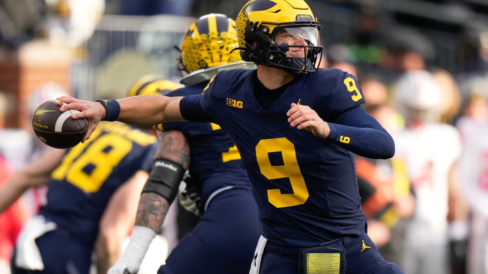 Football player throwing in passing stance