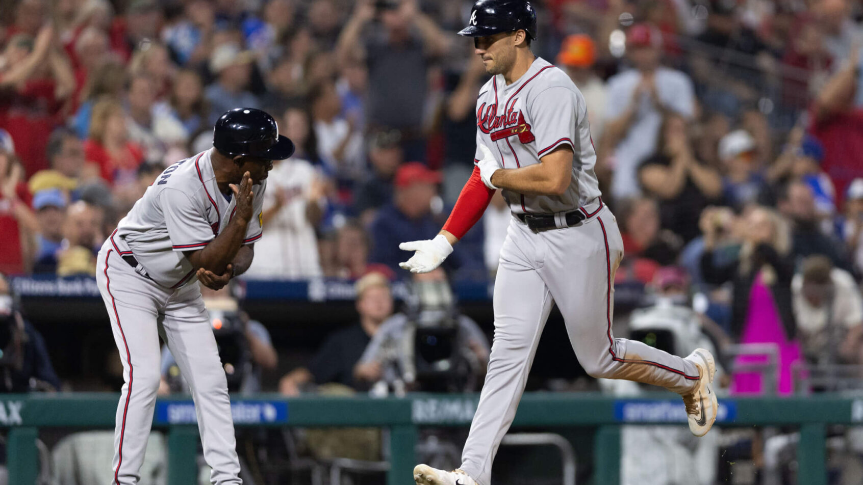 MLB players celebrate at home plate