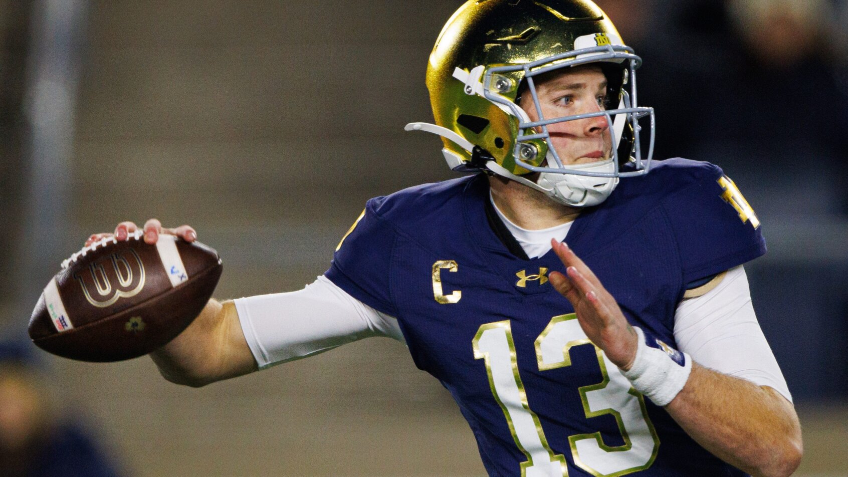 QB throwing football during game