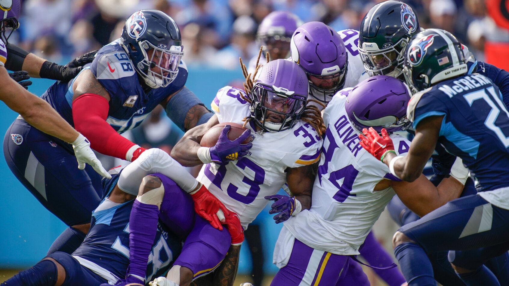 Football players collide during tackle