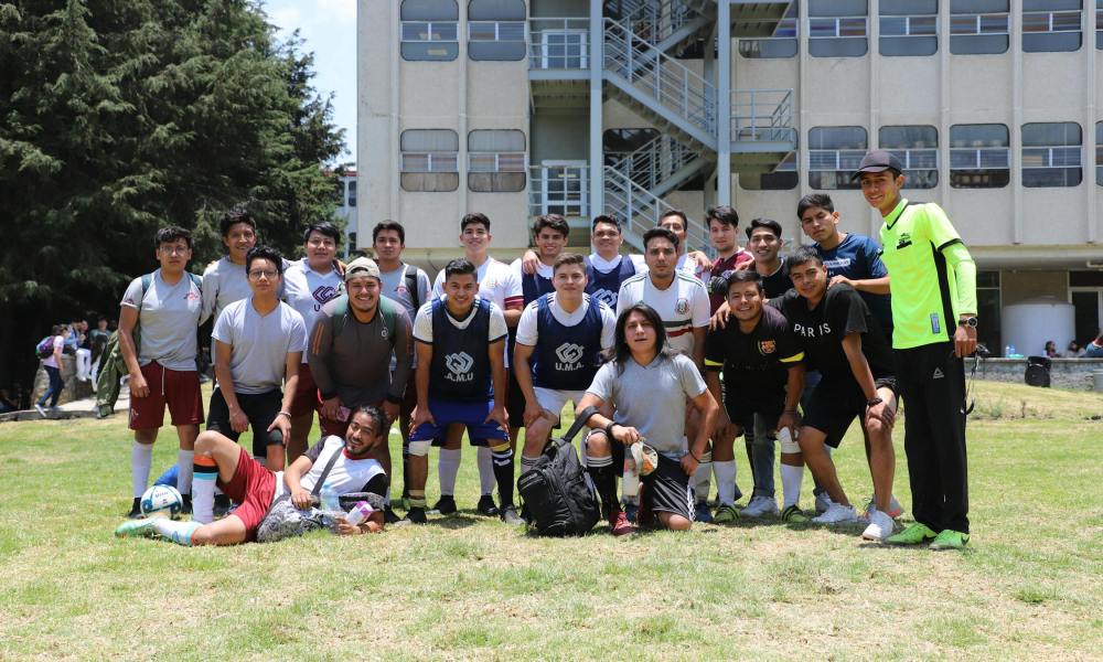 Soccer teens huddled in training uniforms