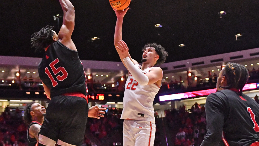 Player leaping for slam dunk