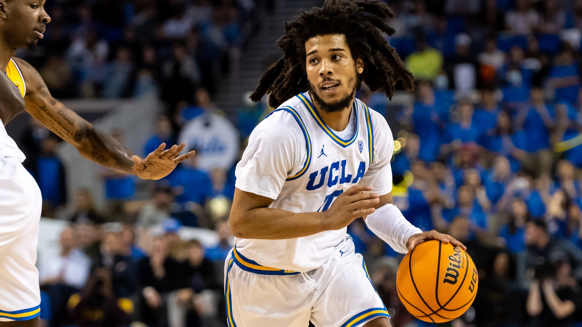 Basketball player clutching ball