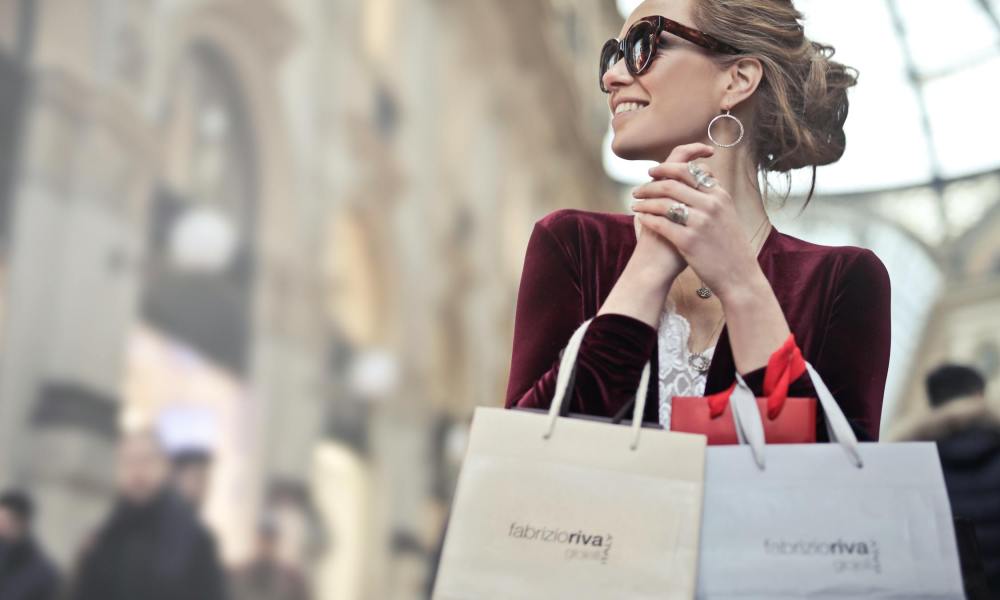 Woman smiling with shopping bags