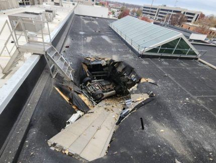 Car wreck on damaged casino roof