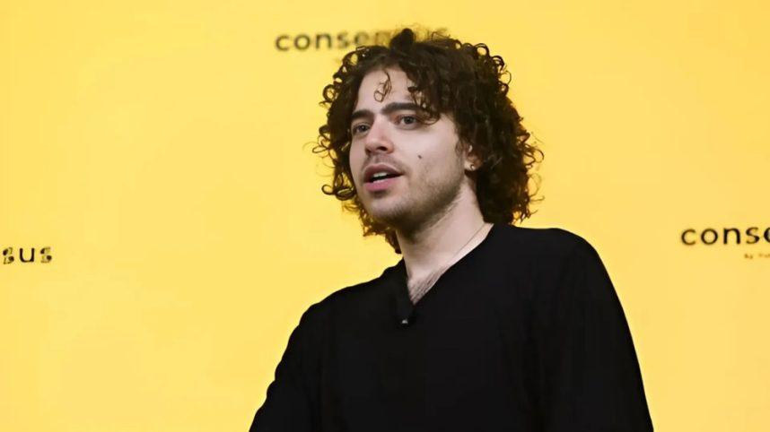 Man speaking against yellow background