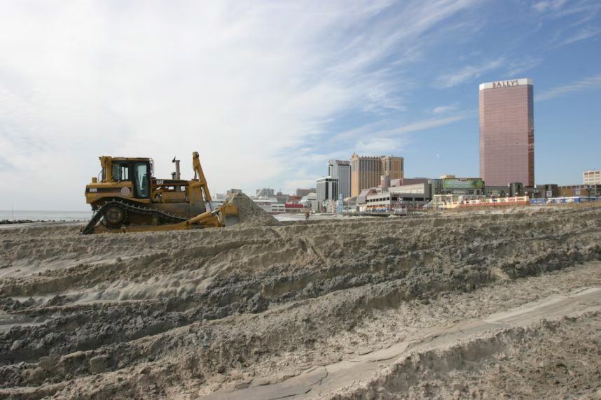 Heavy machinery on beach skyline