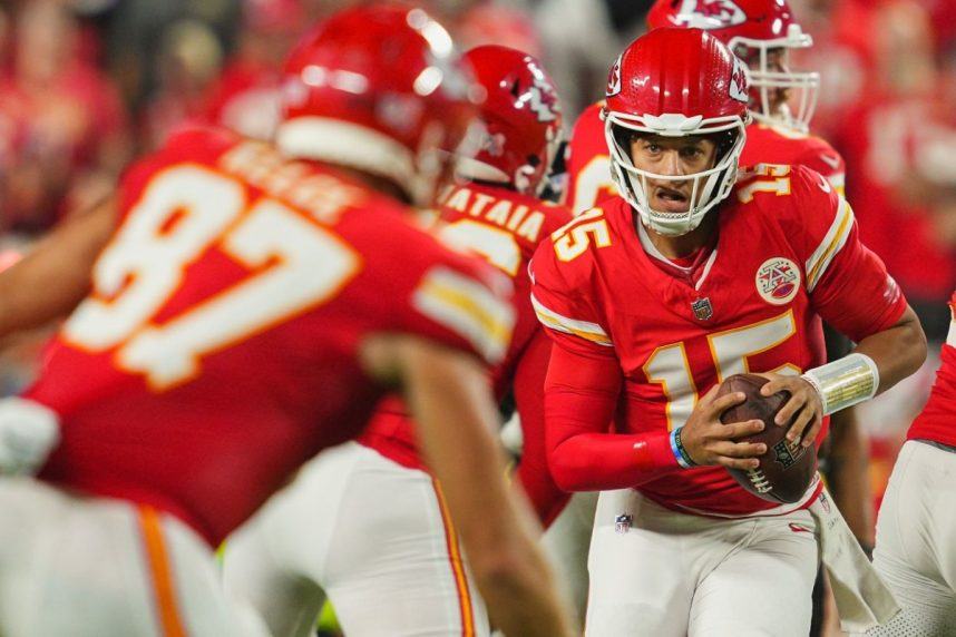 Chiefs player with football during Ravens game