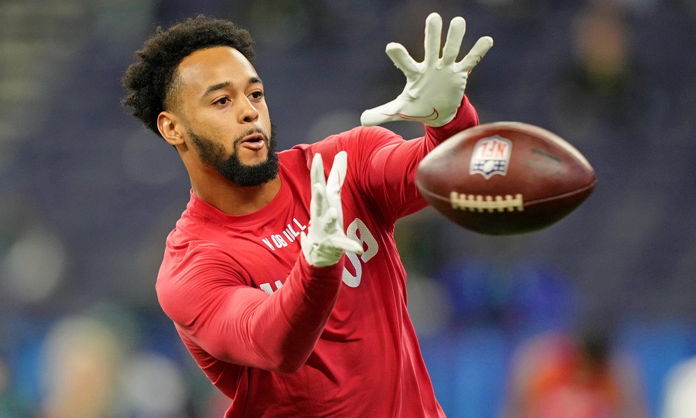 Player leaping to catch football