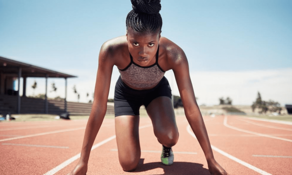 Woman in track running stance