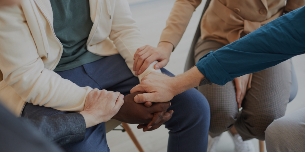 Group therapy session with seated participants