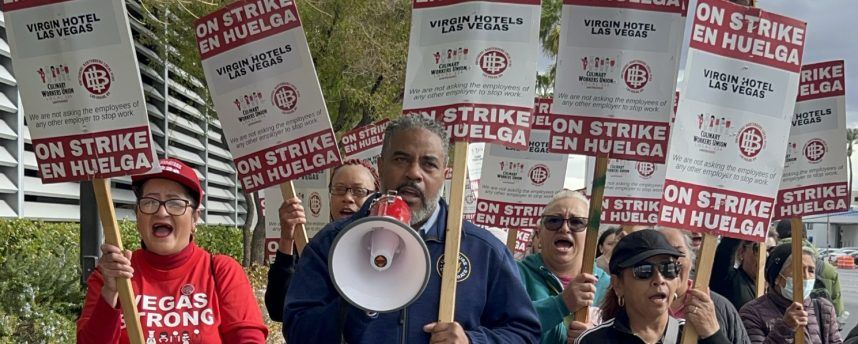 Striking workers with protest signs