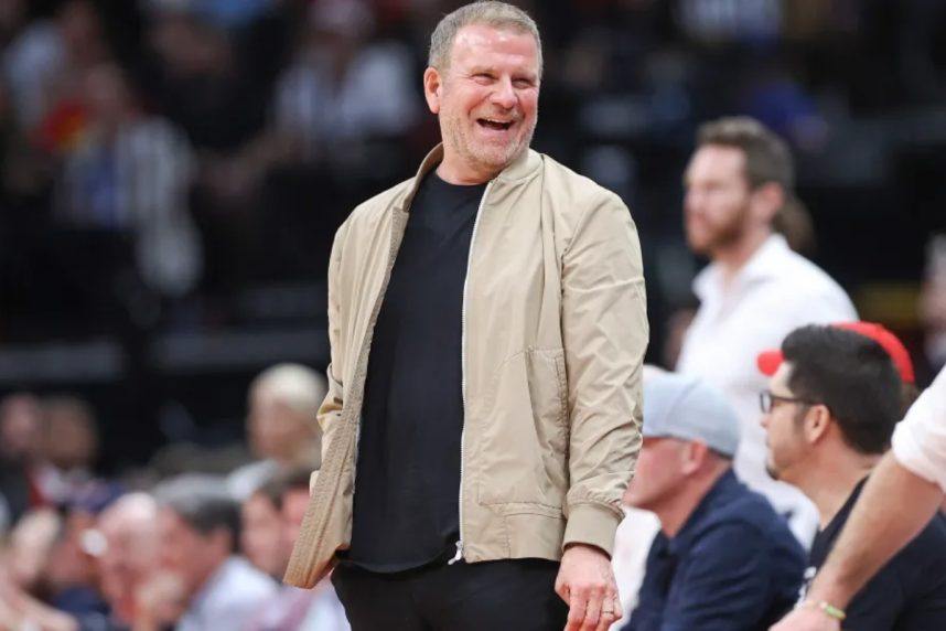 Spurs coach smiling during Rockets game