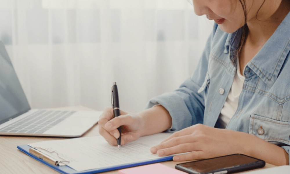 Person with clipboard taking notes