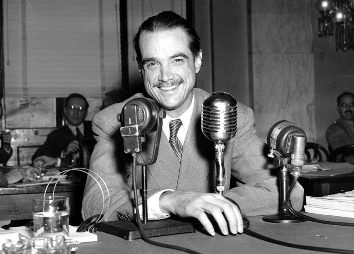 Man smiling with radio microphone