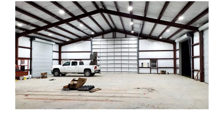 White truck inside industrial warehouse