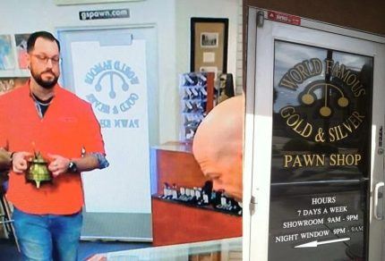 Man holds item at pawn shop