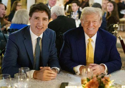 Trudeau and man at meeting table