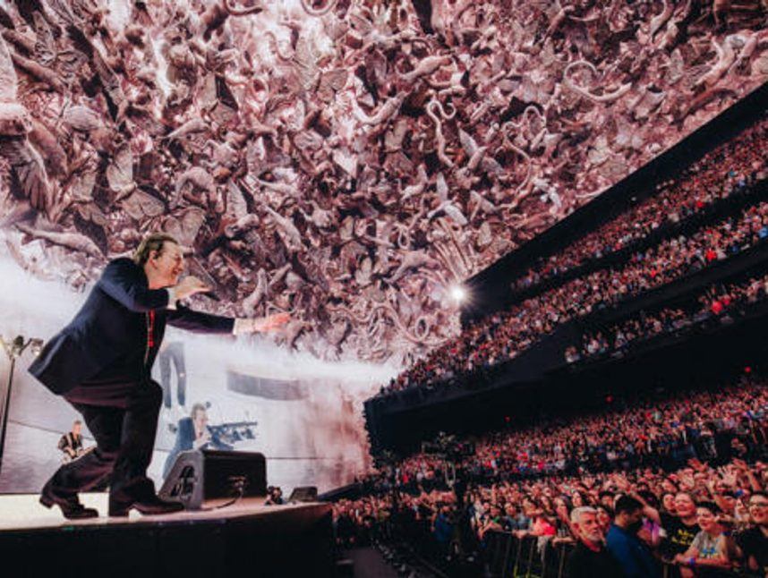 Bono performing with U2