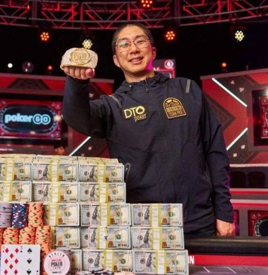 Man holds red WSOP poker chip