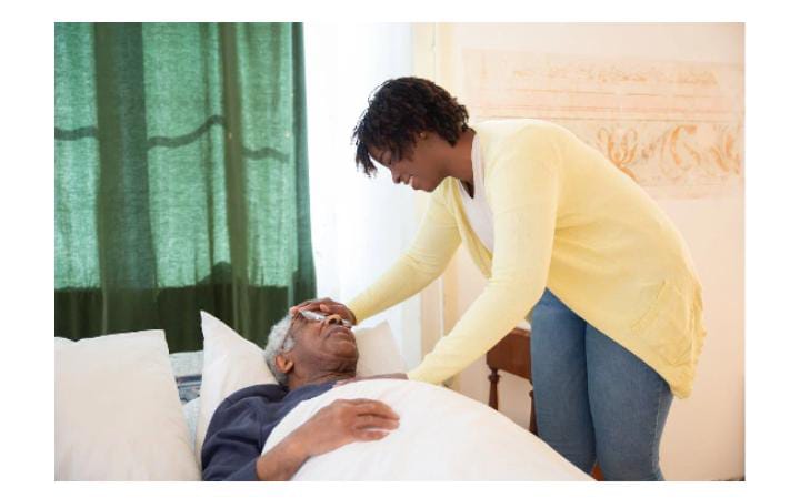 Caregiver assisting elderly man