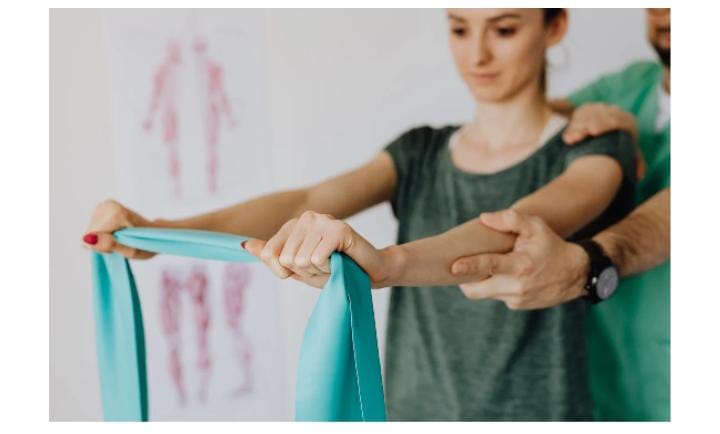 Woman stretches with resistance band