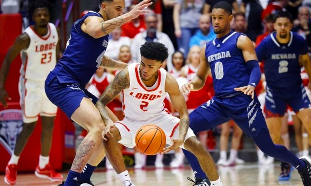 Two Nevada players celebrating basketball victory