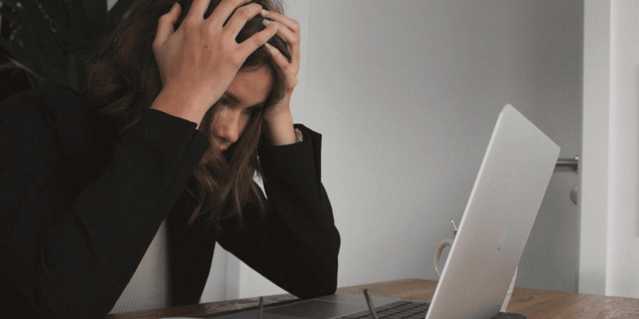 Stressed woman at laptop