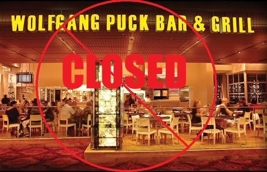 Closed Wolfgang Puck restaurant sign