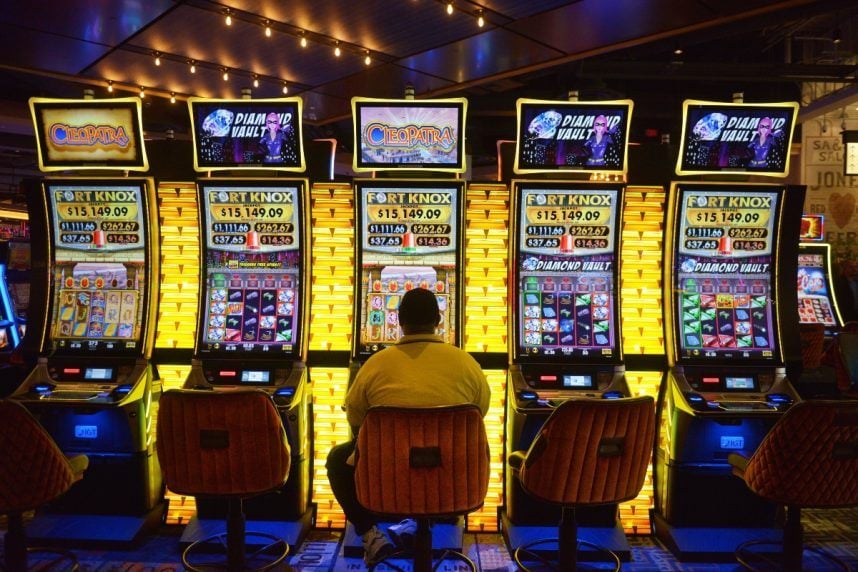 Gambler at casino slot machine