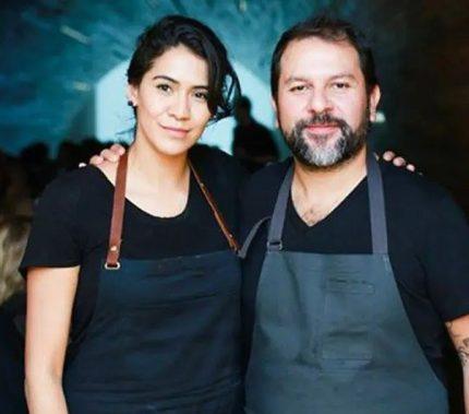 Two chefs in white aprons