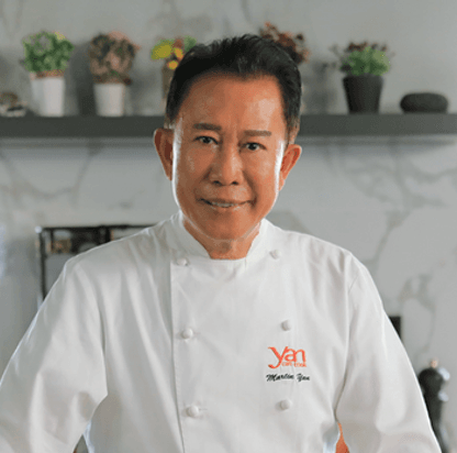 Chef wearing traditional white uniform