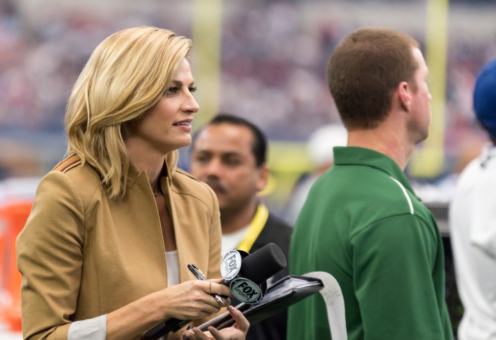 Blonde reporter with broadcast microphone