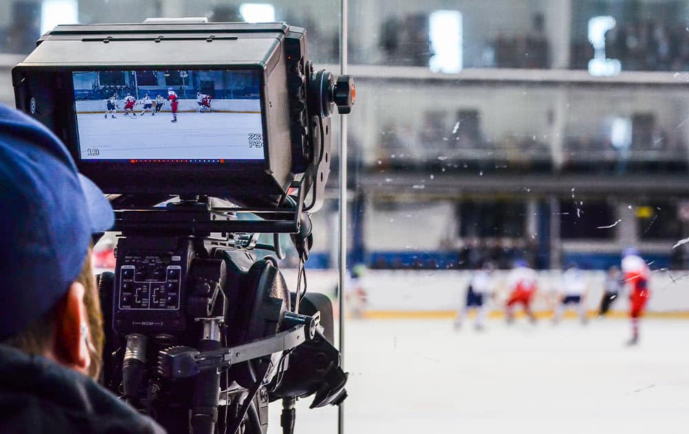 Camera filming NCAA hockey game