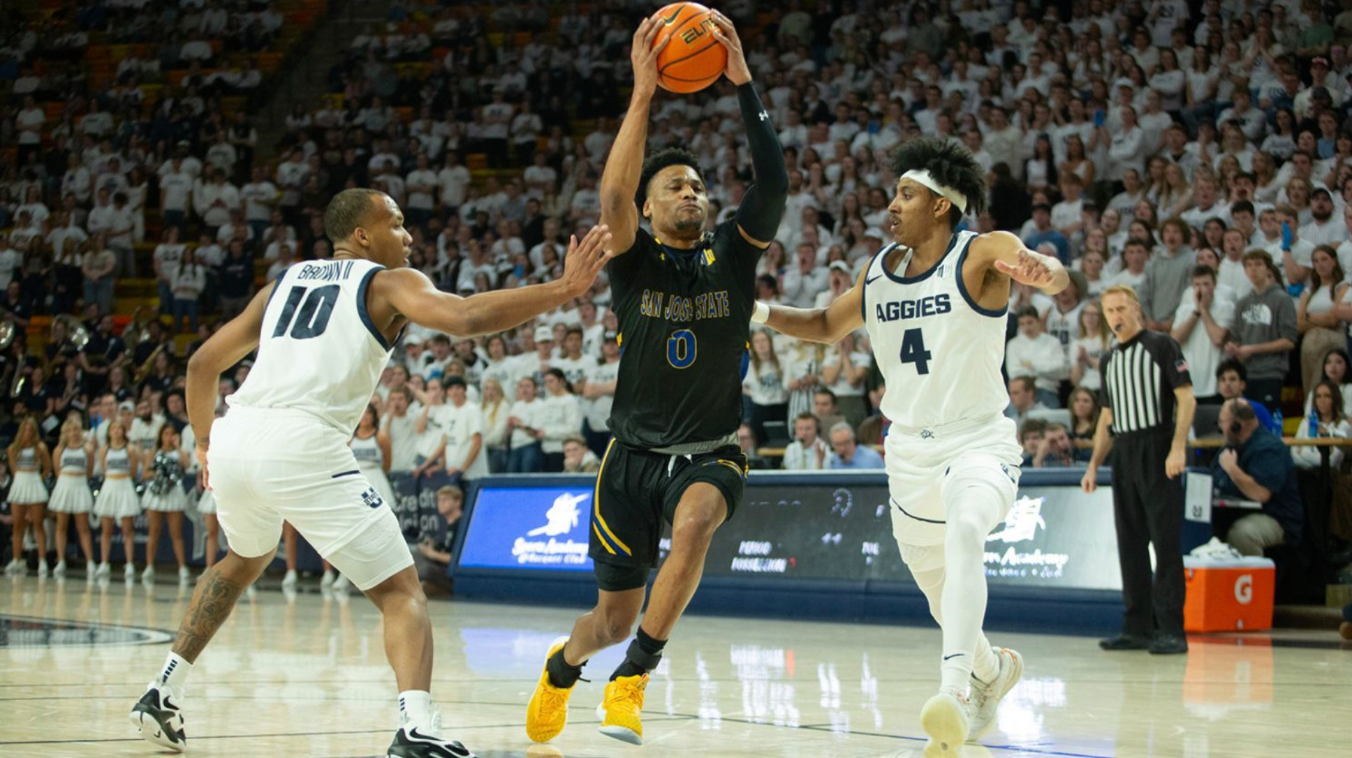 Basketball player blocks shot attempt