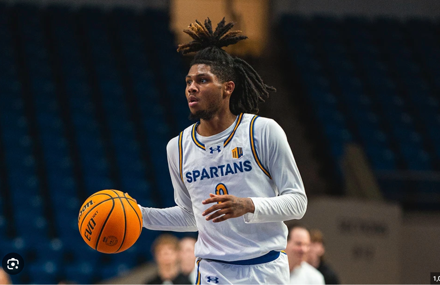 Basketball player jumping for layup