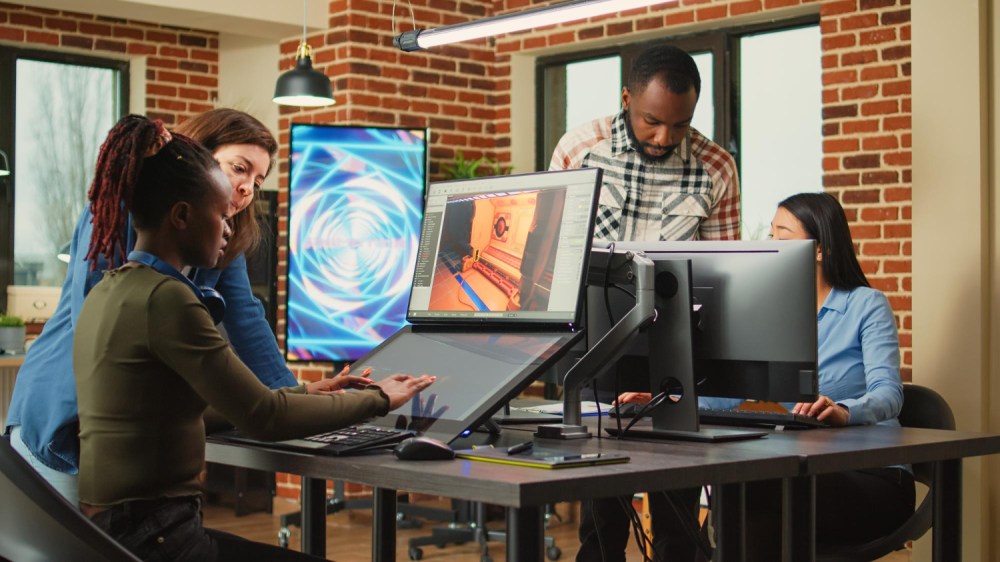 Four people collaborating in office