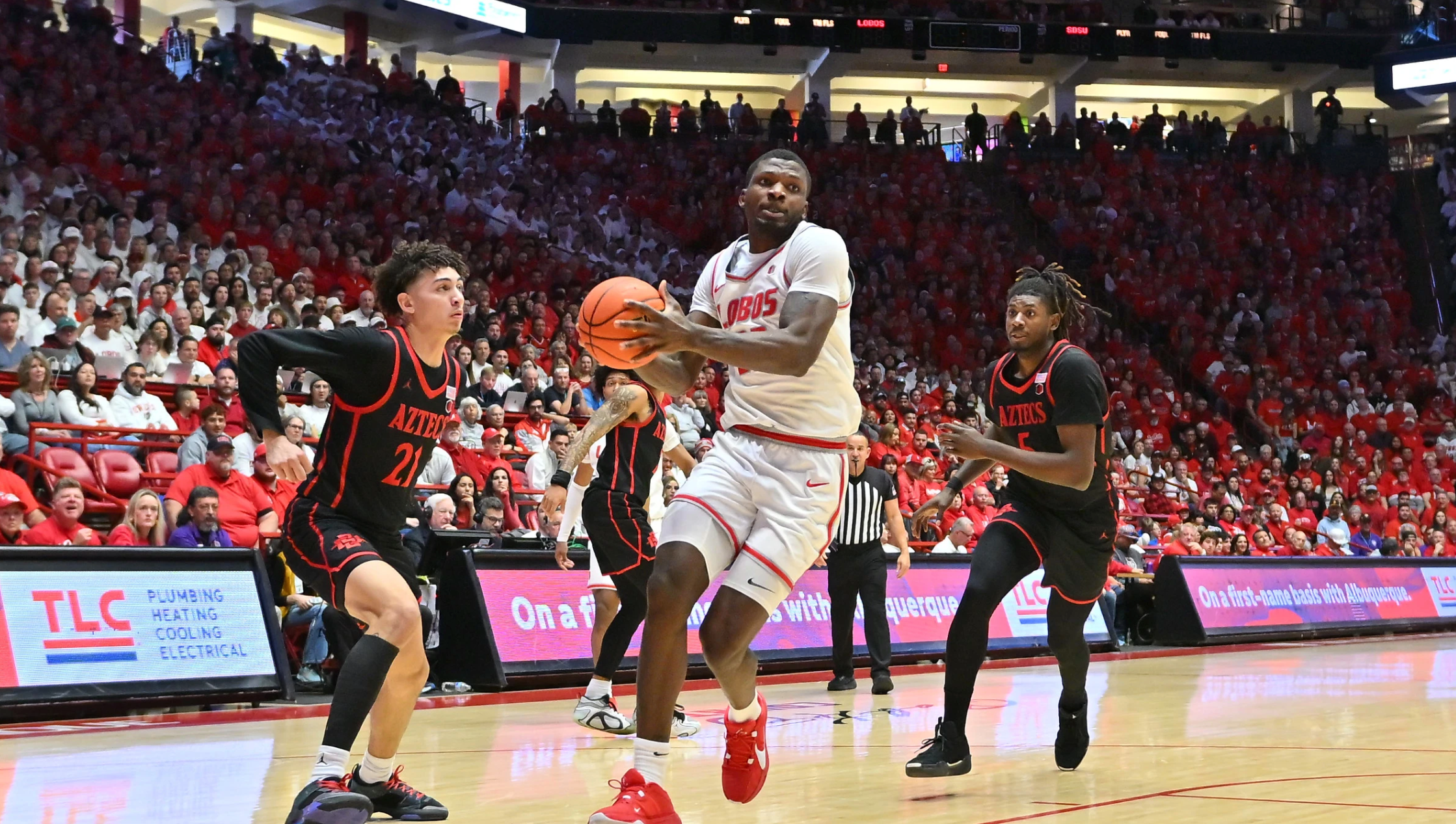 Basketball player shooting during game