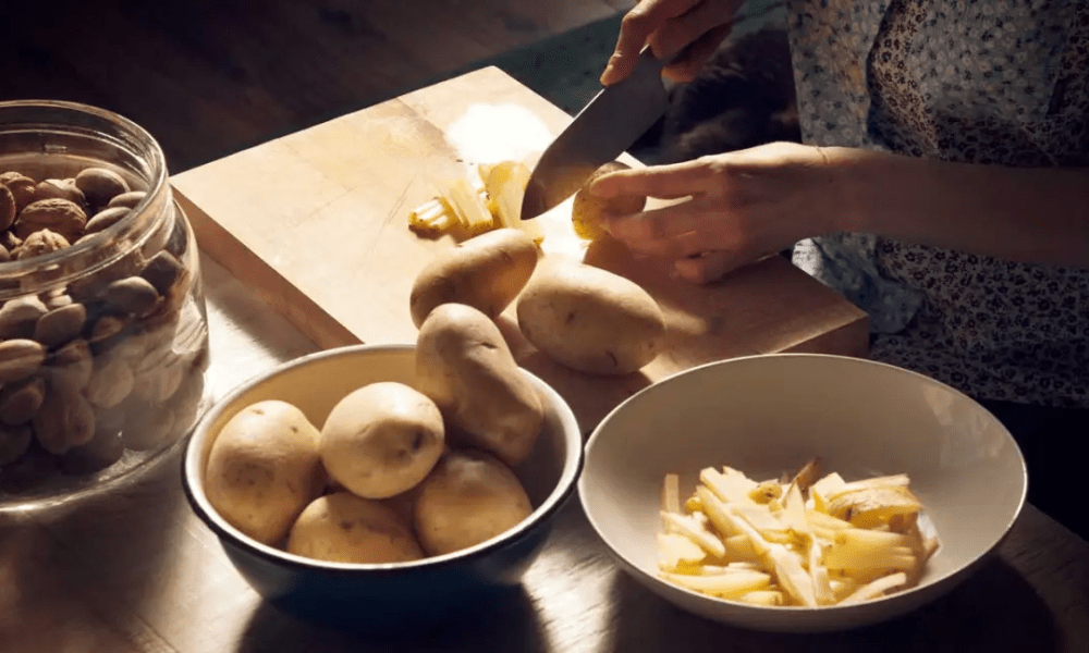 woman peeling potatoes