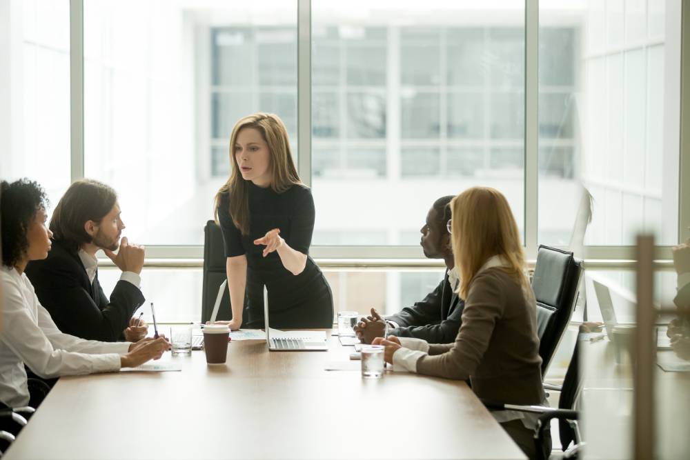 Woman leads marketing team meeting