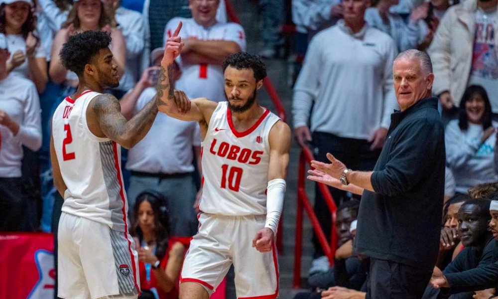 Lobo player celebrates with Coach Pitino